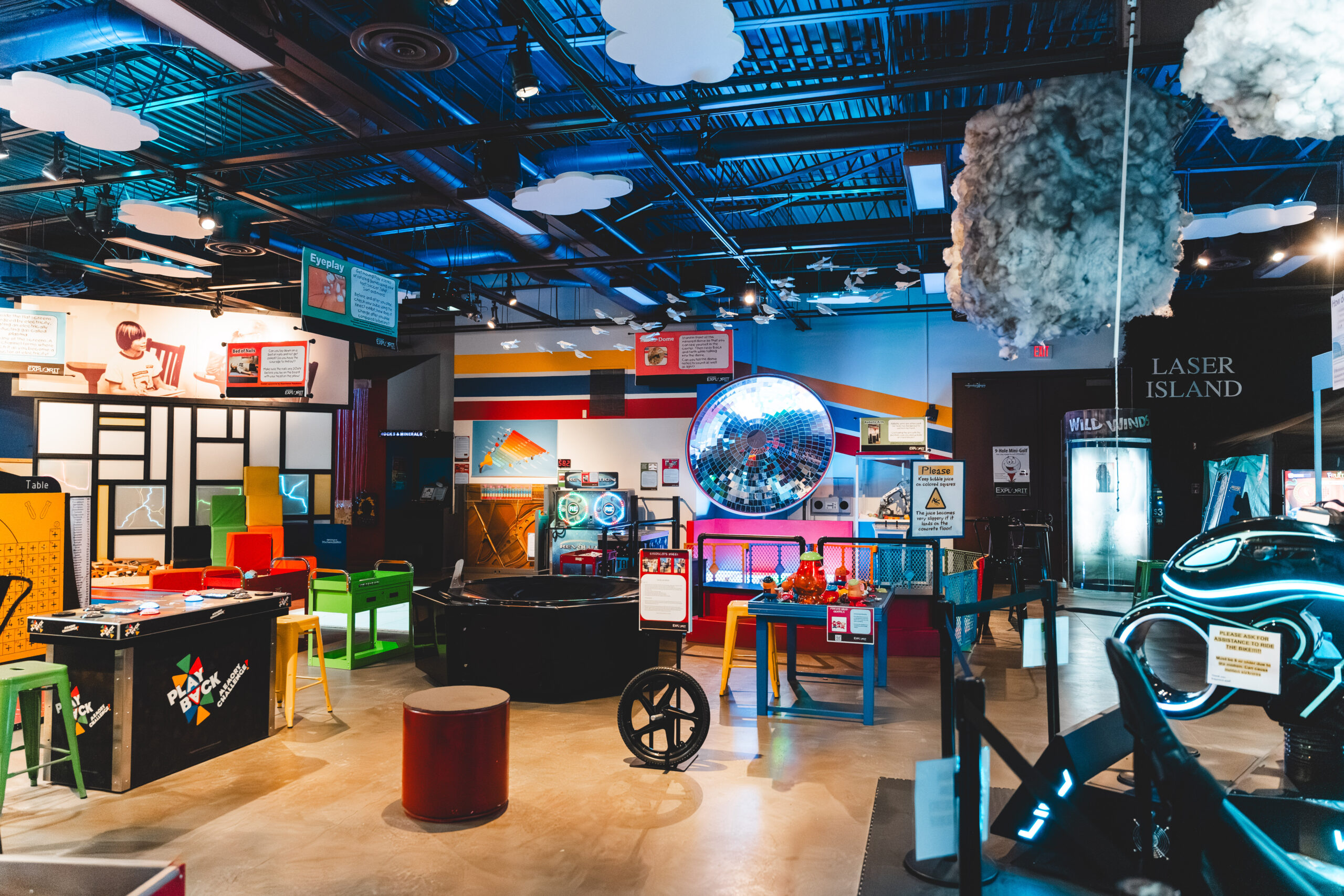Inside of edjerton center showing lots of children museum exhibits