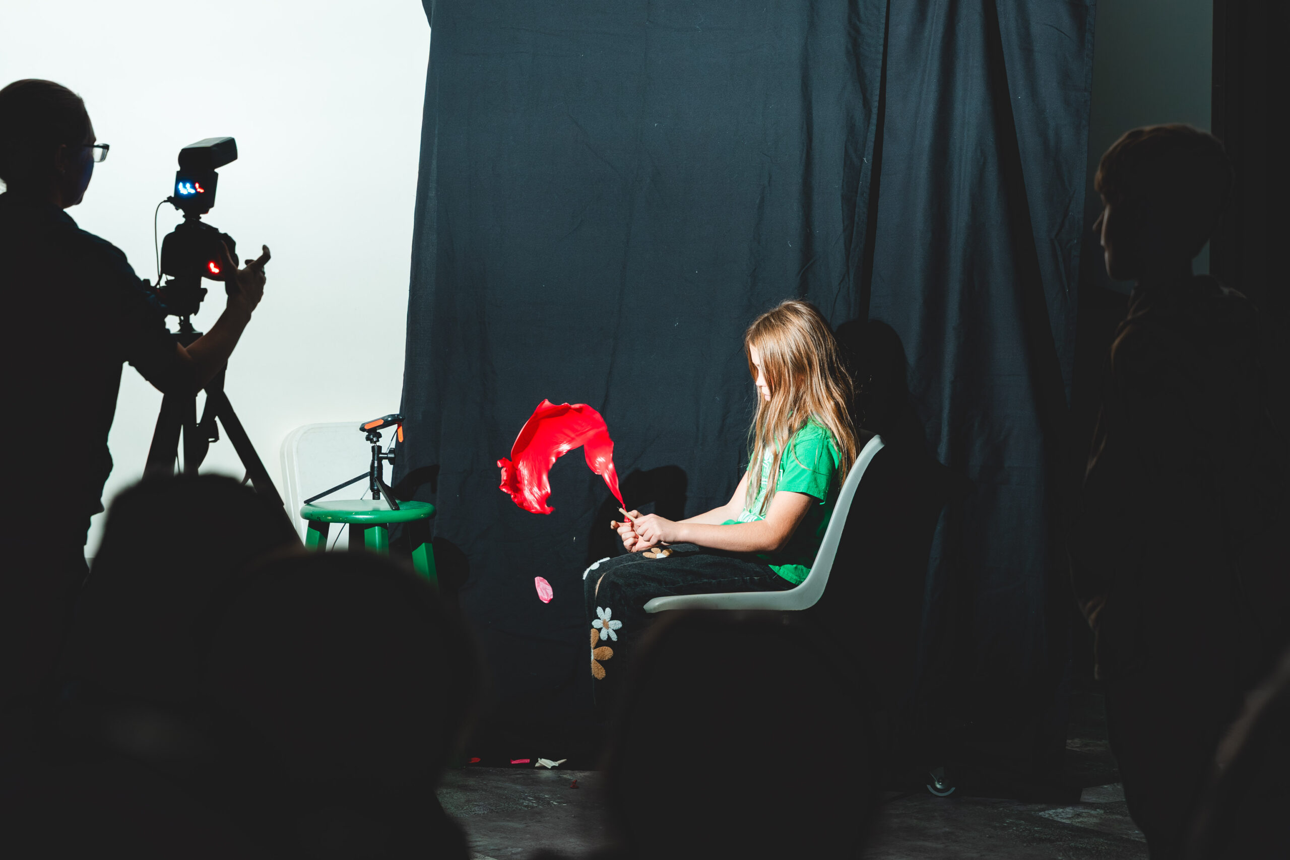 student sitting in a chair doing a science experiment
