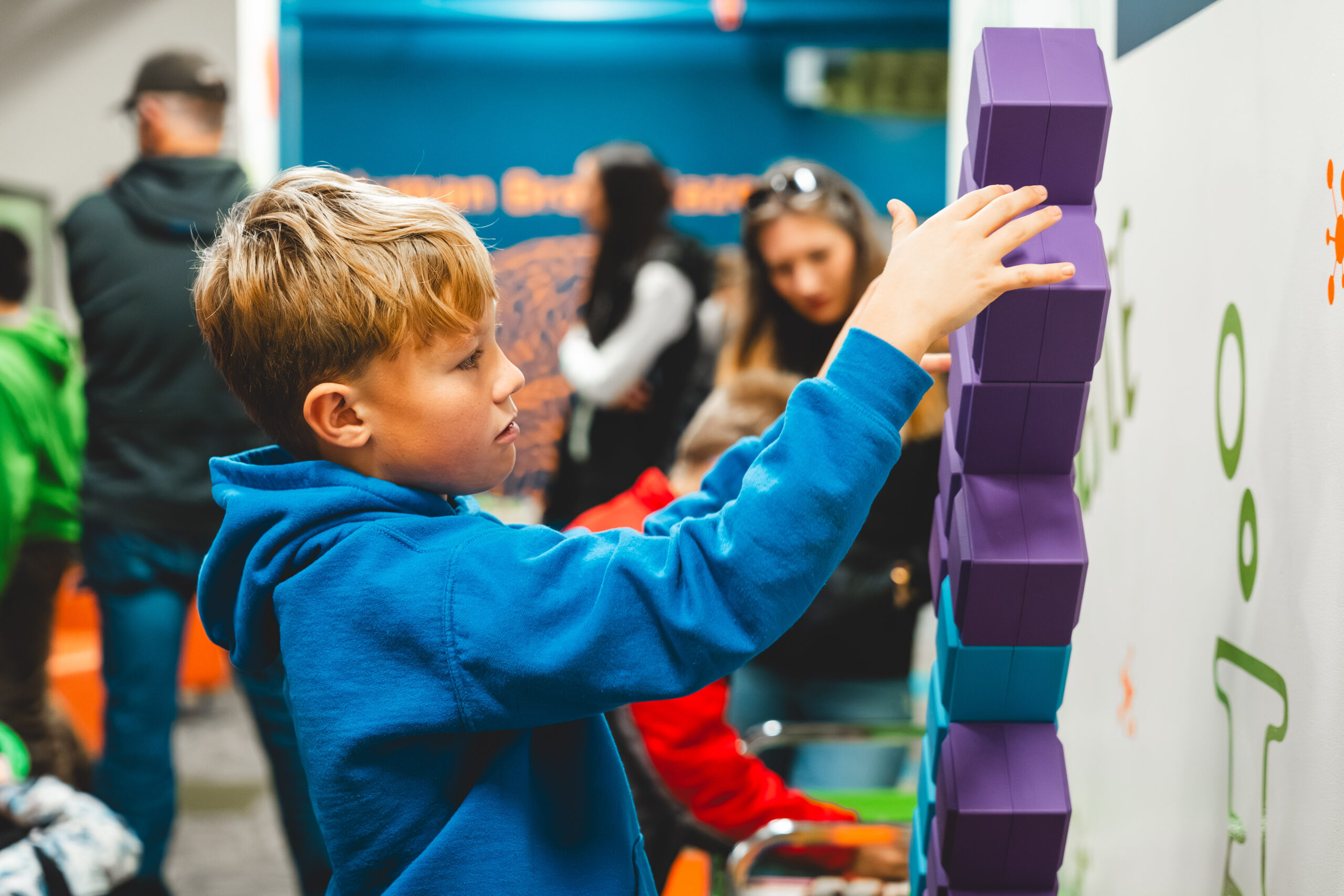 boy playing with an exhibit at the edgerton center.